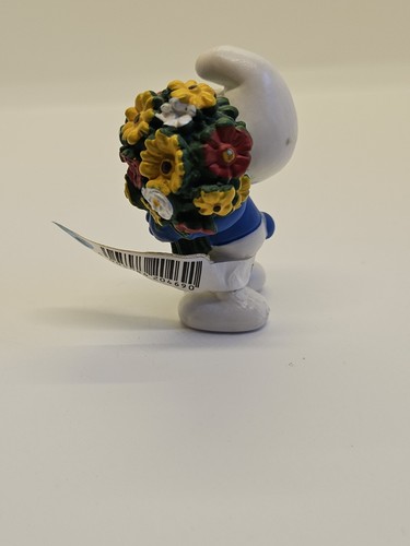 Peyo schlumpf mit blumen - peyo,
