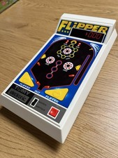 TOMY Power House Pinball Handheld Electronic Game — 1970s