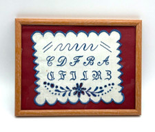 Altes Stickmuster Tuch gerahmt