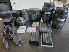 Olympus E-300 body + Zuiko 14-45mm + Zuiko 40-150mm + Zuiko  25mm
