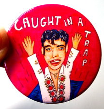Elvis Presley badge caught in
