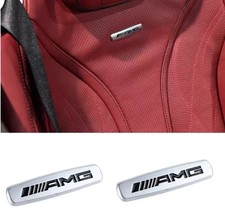 2x AMG Emblem Logo Schriftzug Sitze Mercedes W204,W207,W211,W212,W213,W221,W223