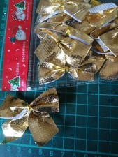 24 Deko-Schleifen Gold mit Befestigungsclip ca. 7 cm breit