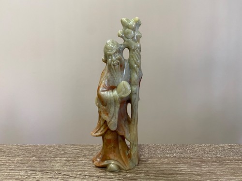Stone figurine elder - of, an