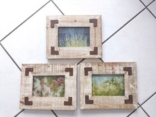 Dekorative Bilderrahmen aus Holz mit Metallbeschlägen