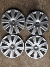 Vier gebrauchte VW Radkappen