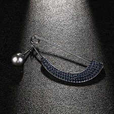 aus aus  Schmucknadel  Brosche