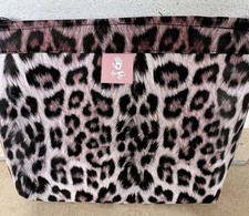 clutch Animal Handed By