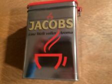 Alte Blechdose,Jacobs,22,5 cm hoch,mit Rotem kunststoffdeckel,gebraucht.