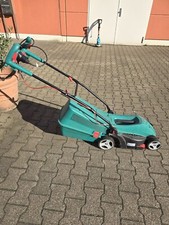 Bosch ARM 34 1300W Elektro-Rasenmäher und ART 23 SL Rasentrimmer