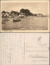 Strand mit Booten - Umkleidekabinen