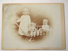 2 Children with Doll and