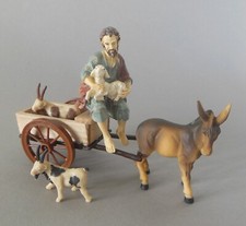 Hirte sitzend auf Wagen mit 2