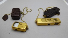 MINOX 8x11 Kamera und Belichtungsmesser in Gold mit Kroko-Taschen und Ketten