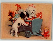 39884547 - Junge Hunde spielen mit einem Puppenwagen Teddybaer Kasperle