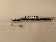 PIPPA & JEAN Armband schwarz-weiß Casual-Look Damen Armschmuck Arm Decoration 