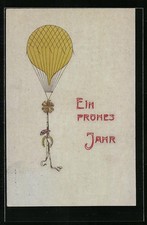 Präge-AK Ein frohes Jahr, Fesselballon mit Glücksbringern 