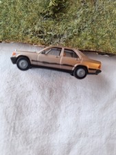 Modellauto 1:87 von Herpa  Mercedes 190 E gold mit bemalten Zierleisten seitl.