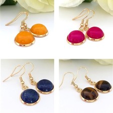 Goldene Ohrringe mit Edelstein