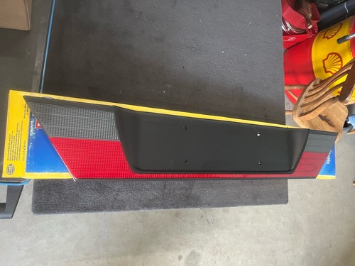 W124 heckblende hella - heckblende, neu+ovp