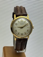 JUNGHANS TRILASTIC HANDAUFZUG HERRENARMBANDUHR UM 1965