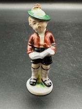 Porzellanfigur Junge Buch