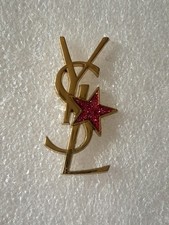 Anstecknadeln Yves Saint