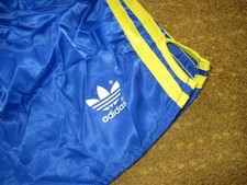 vintage Adidas  Beckenbauer glanz nylon shiny Shorts Hose D7 M/L blau gelb NEU