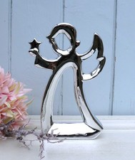 Engel mit Stern stehend