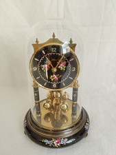 Quarzuhr von Kern mit Glasdom und Drehpendel-Optik Schwarz Gold