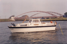 Foto-Ak 1987. Bei Hannover Linden,  Kanal, Motorboot, Boot, Eisenbahn - Brücke
