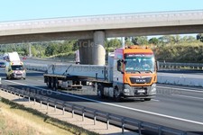 LKW Foto MAN TGS Plattformanhänger Frankreich orange Universal Transport #l2ay
