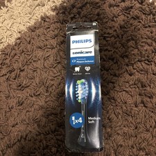 Philips Sonicare Premium Plaque Defence Medium/Soft Bürstenköpfe, 4er Pack, Schwarz c3