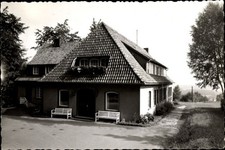 Ak Ostercappeln in Niedersachsen, Haus mit Satteldach, Bänke vor... - 4813502