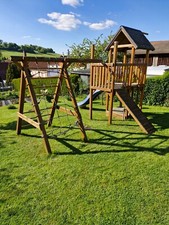 kletterturm mit rutsche und schaukel