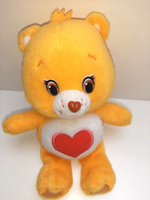 Fast wie neu: superweicher Care Bears Plüsch gelb mit rotem Herz a ca. 30 cm