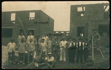 Worker building a house with