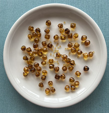 120 lose honigfarbene Perlen