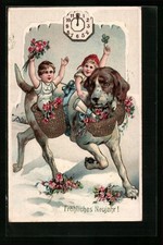 AK Zwei Kinder reiten auf einem Hund durch den Schnee, Körbe mit roten Blumen 