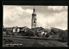 Kastelruth, die Kirche vor einem Dolomitenpanorama, Ansichtskarte 
