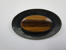 Design  Brosche - N.E. From -