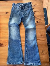 Robuste, blaue Schlagjeans, Used -Effekt, der Marke H&M in Größe 134