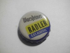 Gebrauchter, blau-cremefarben-gelber Kronkorken Warsteiner RADLER 0,0% ALKOHOL
