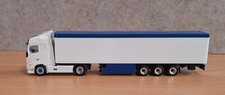 Herpa SZM Volvo FH mit Schubboden-Auflieger in weiß-blauer Farbgebung
