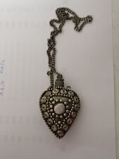 Seltener Parfümflakon aus Metall in Herzform an Kette wohl Afrika um 1970