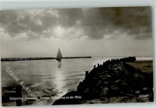 52298792 - Dievenow Sonnen Untergang an der Mole Segelboot Dievenow / Dziwnow