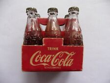 6 alte Coca-Cola Flaschen im Orig Trägerkarton. 40er-50er Jahre mit Metallkapsel