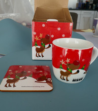 Henkelbecher mit Untersetzer