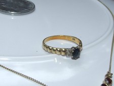 Ring 585 Gold mit Saphir + 4