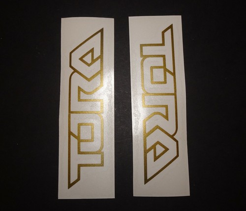 Tora gold outline only logo - 2,